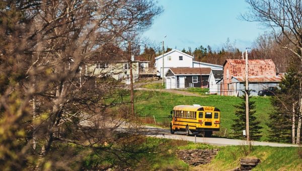 School bus passing a rural farm