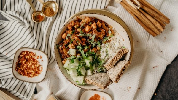 A plant-based bowl of rice, chickpeas, and vegetables